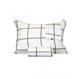 White duvet cover and pillowcases with a plaid pattern of thin black and gold-toned lines.