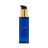 Thameen Rivière body lotion in a deep blue rectangular glass bottle with a gold-toned pump and black dispenser.
