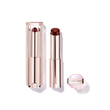 Lancome Lip Idole Butterglow lipstick in dark reddish-brown, with a clear ribbed cap and rose gold-toned base.