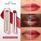 Gold-toned ribbed lipstick tube with a clear rectangular cap, revealing a deep cherry red bullet.