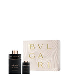 Bvlgari Man in Black Eau de Parfum luxury gift set featuring a large bottle, a mini travel size bottle, and an elegant textured cream presentation box with gold lettering, available at blue salon.