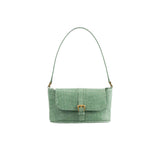 Front view of the BY FAR Miranda baguette bag in a light green croco-embossed leather featuring a matching shoulder strap and gold-tone buckle against a light grey background.