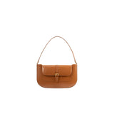 Front view of the BY FAR Miranda shoulder bag in Summer Tan semi-patent leather with a gold buckle detail and slim shoulder strap against a grey background.