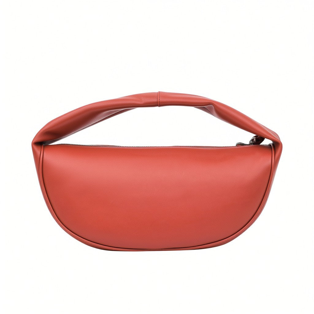 Back view of the minimalist burnt orange leather shoulder bag by By Far, emphasizing its seamless crescent silhouette at BLUE SALON.