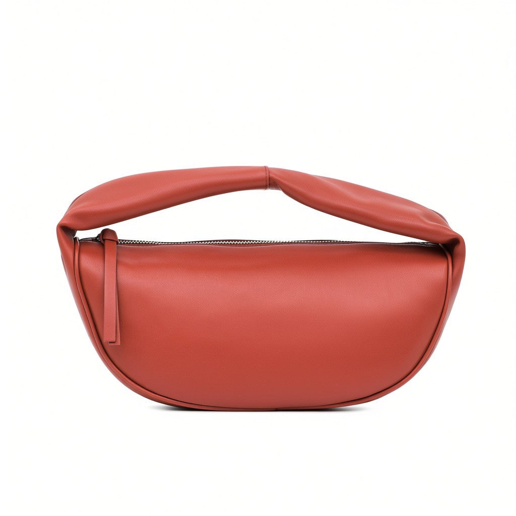 Front view of a burnt orange leather crescent shoulder bag by By Far at BLUE SALON, featuring a zippered top and a padded top handle.