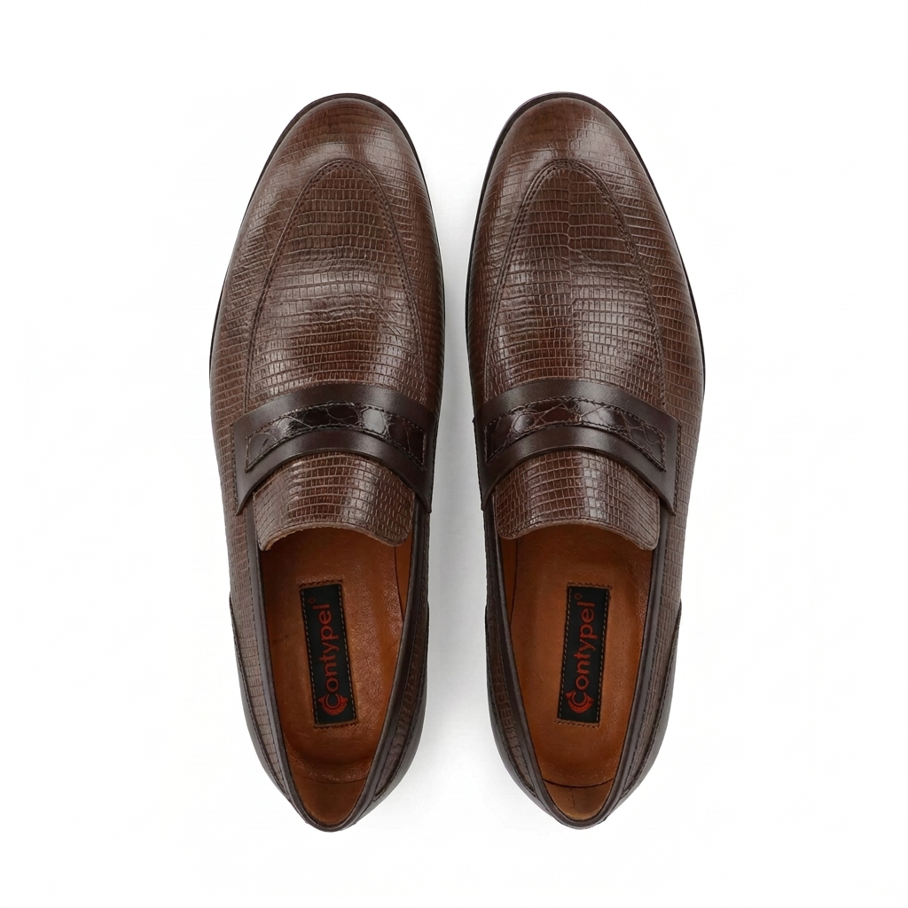 Pair of brown lizard-embossed leather loafers with a darker, crocodile-embossed strap across the vamp.