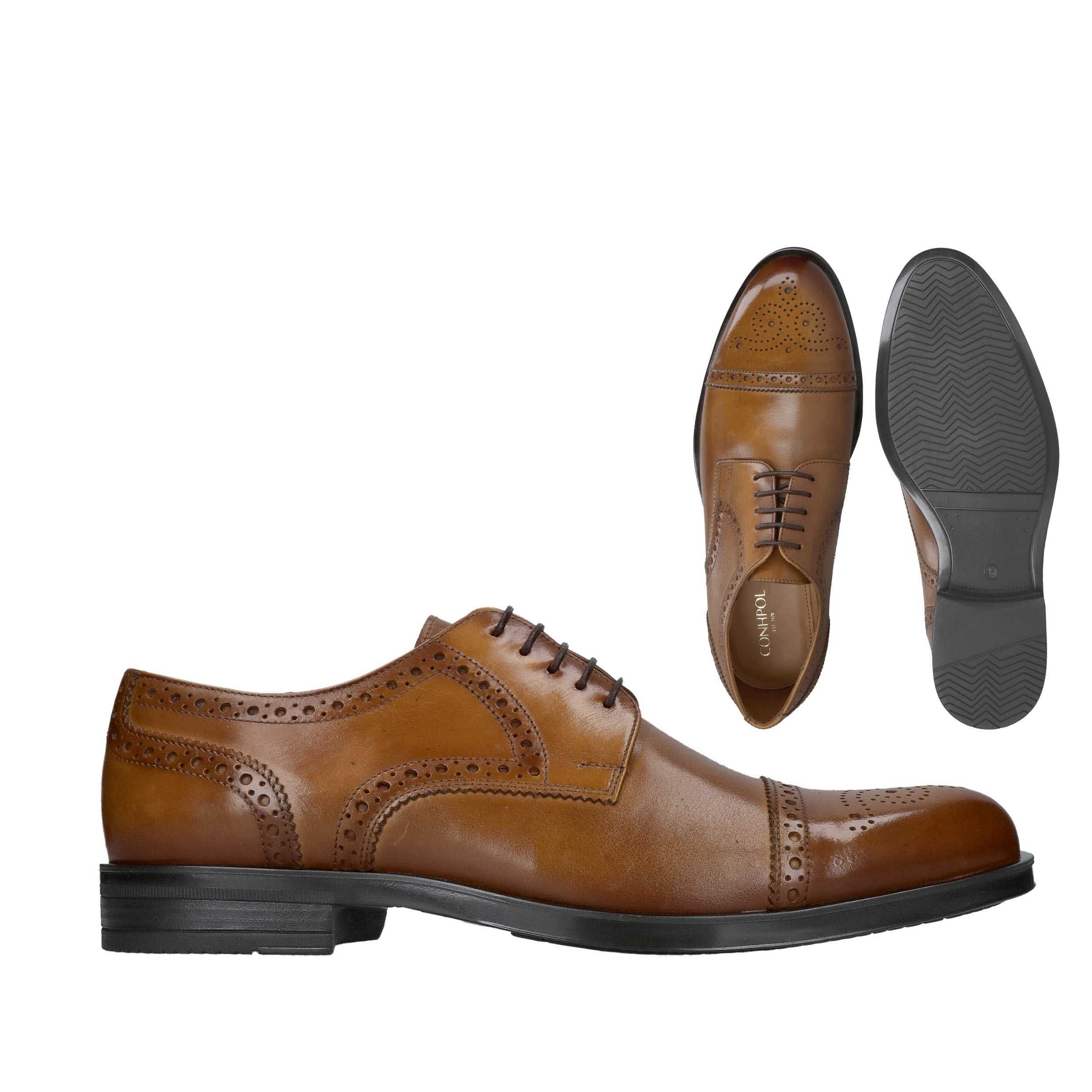 Brown leather brogue shoes with perforated detailing, cap toe, and closed lacing. Black sole and heel.