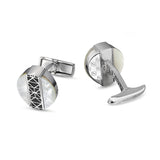 Silver-toned cufflinks with round mother-of-pearl faces and black geometric lattice. Monograms and 'CHAMP DE MARS' engraving