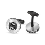 Silver-finished cufflinks with black 'S' pattern. One has a black 'S' logo on face. Toggles, one engraved 'SAINT HONORE'.