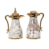 CASA BLU 2-piece luxury thermal Dallah set with white marble finish, gold-plated handles, and geometric Arabic star patterns on a white background.
