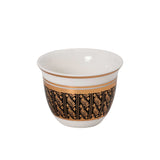 CASA BLU 18-piece luxury beverage set in a black display box, featuring six clear tea glasses with gold rims, six white and gold Arabic coffee cups, and stacked gold-patterned saucers.
