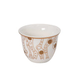 CASA BLU 18-piece luxury tea and coffee set in a black foam-lined gift box, featuring 6 smoked glass tea cups with handles, 6 white porcelain Cawa cups, and matching gold-patterned saucers.