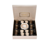 CASA BLU 13-piece host set with gold star lattice geometric patterns on smoked-glass tea cups and white porcelain cawa cups.