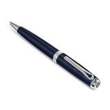 Dark blue pen with fine horizontal grooves, silver-toned tip, mid-band, clip, and cap end with a logo.