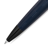 Dark blue pen with diagonal textured grip, black gun-toned tip, and silver-toned ballpoint.