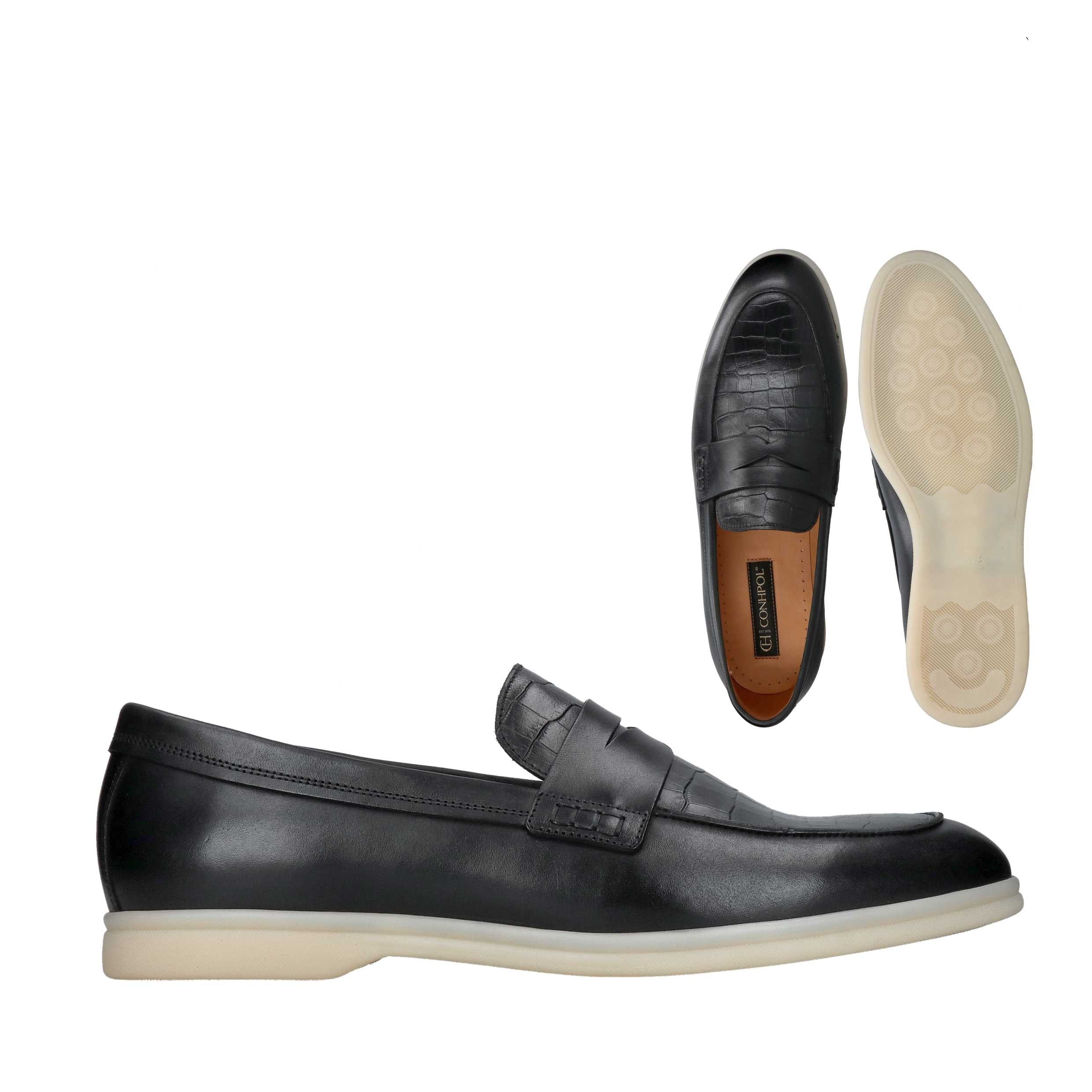 Black leather penny loafers with crocodile-embossed vamp and smooth sides, featuring a light beige rubber sole.