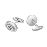 Silver-toned cufflinks. One has grey carbon fiber and a 'C' logo. The other's toggle reads 'CERRUTI 1881'.