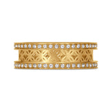 Wide gold-toned band ring with rows of clear stones on the top and bottom edges, and a cutout geometric pattern in the middle