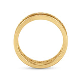 Gold-toned band ring with a recessed channel featuring clear stones on the outer surface and a geometric cutout pattern on th