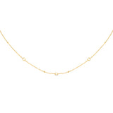 Gold-toned delicate chain necklace with small C logo elements and spherical beads spaced along the chain.