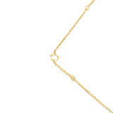 Gold-toned chain necklace with a small C-logo charm and conical beads featuring clear crystals spaced along the chain.