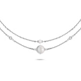 Front flat lay view of the Cerruti 1881 Luciana silver stainless steel double-layer necklace, showcasing the nested chains, small metal bead, and crystal-lined round disc pendant.