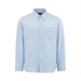 Light blue long-sleeved button-down shirt with a textured fabric, button-down collar, white buttons, and a left chest patch p