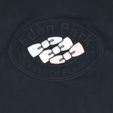 Dark blue shirt with an oval logo patch. It features 'Eden Park' and 'French Flair' text, and three bow ties: light blue, whi