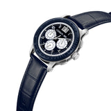 Silver-toned watch with a dark blue dial, three white subdials, and a date window, on a dark blue crocodile-embossed leather