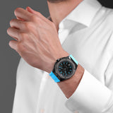 Octagonal gunmetal watch with black carbon fiber dial, blue accents, and a sky blue silicone strap.