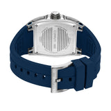 Silver-toned rectangular watch, back view. Features a blue silicone strap with a silver-toned buckle and an engraved case bac