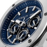 Silver-toned oval watch with a deep blue dial, silver-toned hands, rectangular markers, and three black-rimmed subdials.