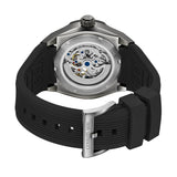 Gunmetal-toned watch with a visible automatic movement on the back. It has a black ribbed silicone strap with a silver-toned