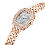 Rose gold-toned tonneau watch with clear stones on bezel, iridescent mother-of-pearl dial, Roman numerals, and link bracelet.