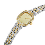 Gold-toned rounded square watch with clear stones on bezel, beige textured dial with stone markers, and two-toned silver and
