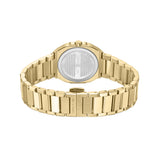 Gold-toned watch with an octagonal case and a brushed metal link bracelet. The case back is silver-toned with engraved text.