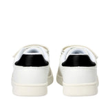 Pair of white low-cut sneakers with black heel tabs, off-white soles, and white velcro straps, viewed from the back.