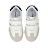 White low-cut sneakers with light grey suede-like toe and side panels, two white velcro straps, and black ankle trim.