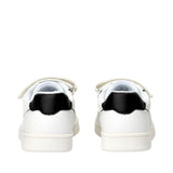 Pair of white low-cut sneakers with black heel collars, white velcro straps, and flat white soles.