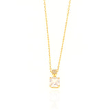 Gold-toned link necklace with a square clear stone pendant. The pendant's bail is a small rectangular piece encrusted with ti