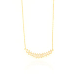 Gold-toned delicate chain necklace with a curved pendant featuring multiple clear baguette-cut stones