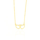 Gold-toned necklace with a delicate chain and two interlocking open heart pendants.