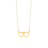 Silver-toned chain necklace with two interlocking, open, gold-toned heart pendants.