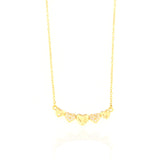 Gold-toned chain necklace with five heart charms, three plain and two embellished with clear stones.
