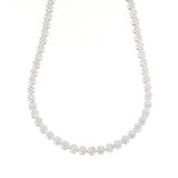 Silver-toned necklace featuring a continuous strand of circular clusters, each set with multiple clear, sparkling stones.