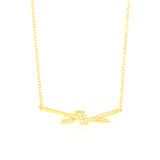 Gold-toned delicate link chain necklace with a central knot-shaped pendant adorned with clear stones
