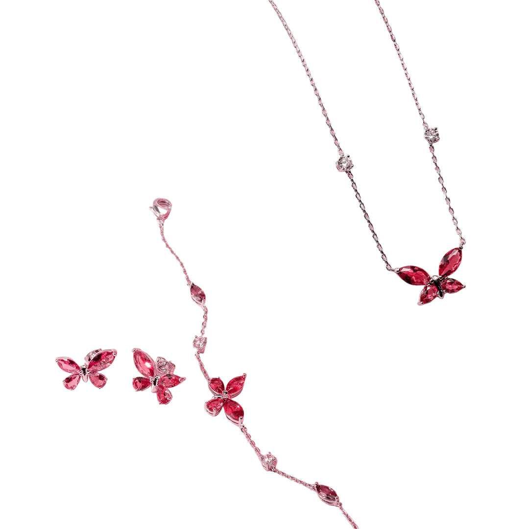 Rose gold-toned butterfly necklace, bracelet, and stud earrings set with fuchsia marquise-cut and clear round stones.