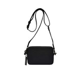 Back view of the Coach Tabby messenger bag in high-shine metallic silver leather, showing a clean rear panel with a full-width exterior slip pocket and tonal perimeter stitching.
