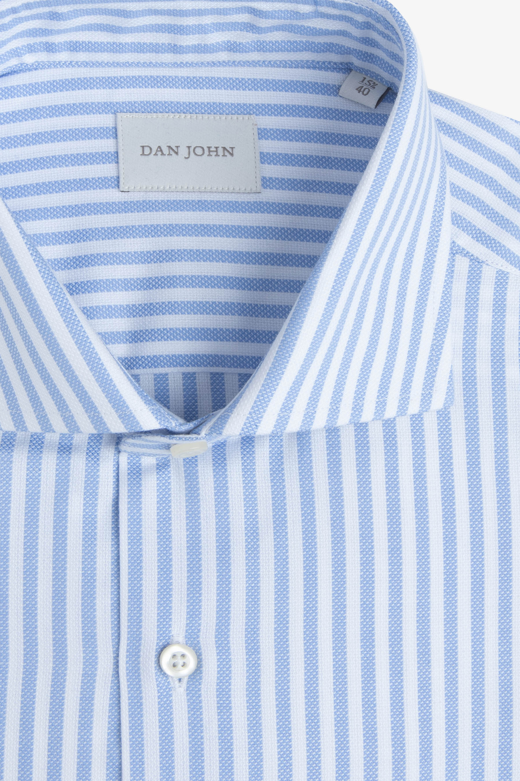 Light blue and white vertically striped dress shirt with a textured weave on the blue stripes, a spread collar, and white but