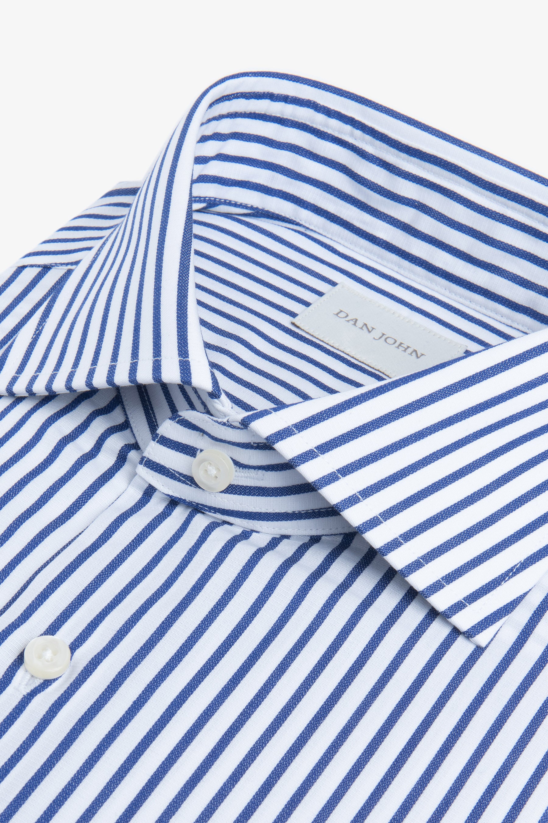 White shirt with royal blue vertical stripes, a spread collar, and white buttons.